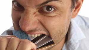 Man Eating Credit Card